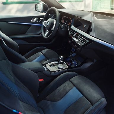 Sporty BMW 1 Series interior. BMW 1 Series cockpit with M Sport seats, M Leather steering wheal and illuminated interior trim finishers.