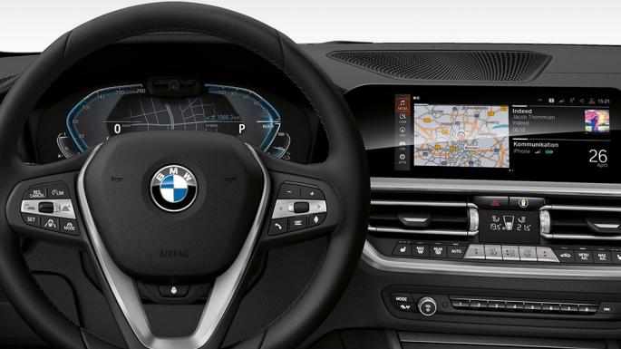 BMW 3 Series Sedan, Cockpit. Detailed frontal view of the BMW 3 Series Sedan cockpit with i-specific display.