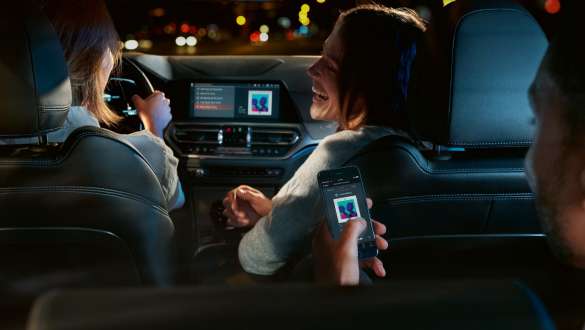 Man interacts via Connected Command. Man interacts via Connected Command from the rear seat.