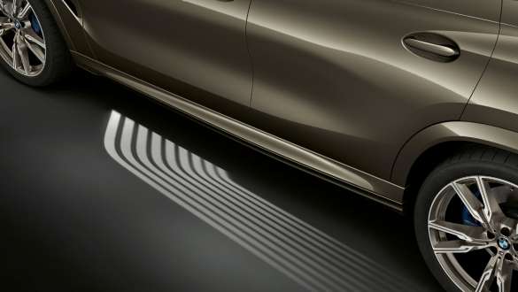 BMW Welcome Light Carpet. Side view of the BMW X6 with focus on Welcome Light Carpet.