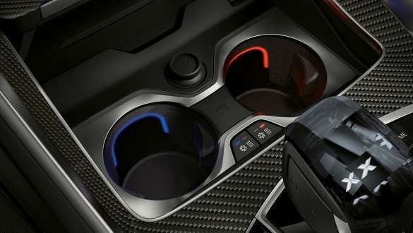Temperature-controlled cupholder. Close-up of the BMW interior with focus on temperature-controlled cupholder.