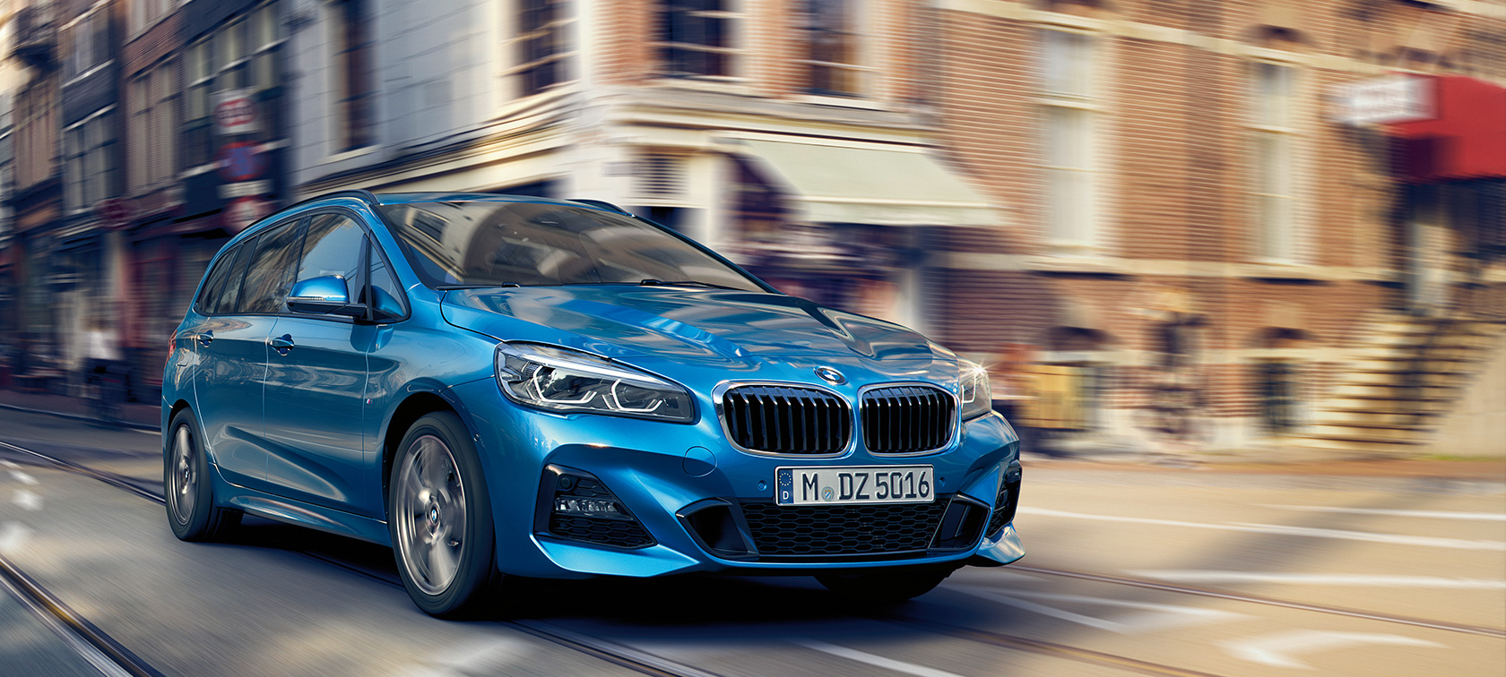 BMW 2 Series Gran Tourer driving on the road BMW 2 Series Gran Tourer F46 2018 Estoril Blue metallic three-quarter front view driving on the road