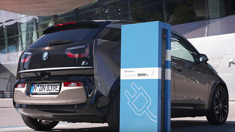 BMW 3 Series Sedan G20 BMW i3 on charging station three-quarter rear view 