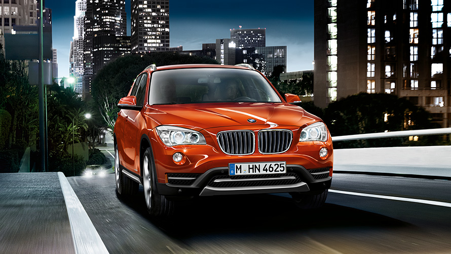 BMW X1 E84 first generation three-quarter front view on the street BMW X Series BMW X1 E84 first generation three-quarter front view on the street