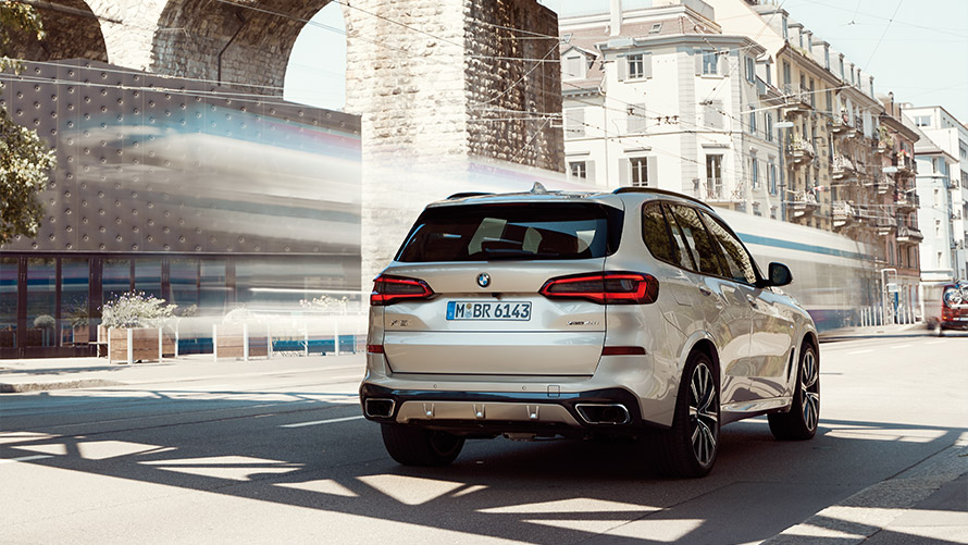 BMW X5 G05 fourth generation three-quarter rear view standing in front of a building BMW X Series BMW X5 G05 fourth generation three-quarter rear view standing in front of a building
