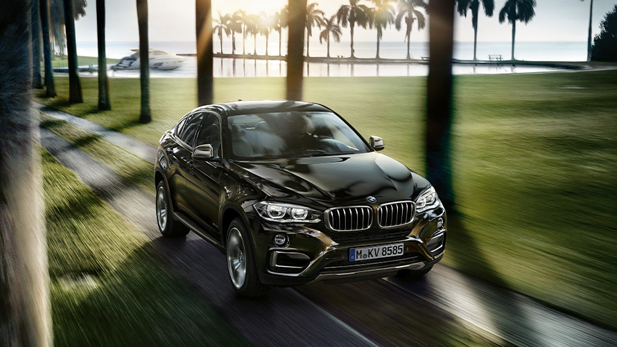 BMW X6 F16 second generation three-quarter front view driving BMW X Series BMW X6 F16 second generation three-quarter front view driving