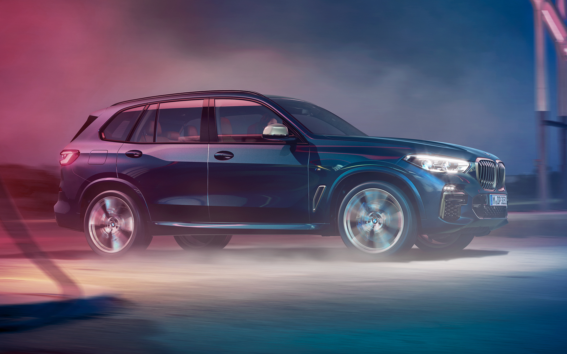 BMW X5 M50d on the move Driving shot of the BMW X5 M50d at night in an urban setting