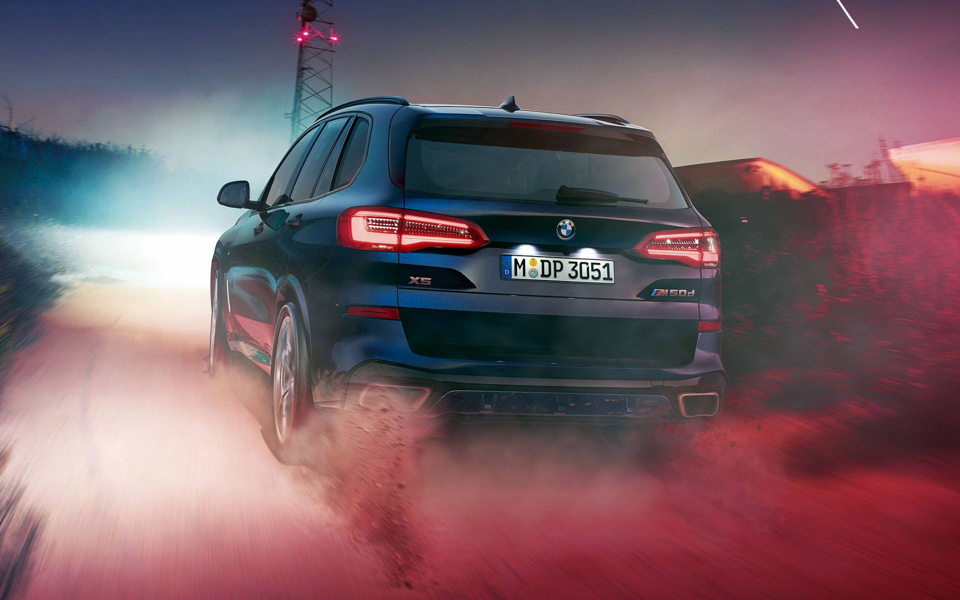 BMW X5 M50d rear Rear of the BMW X5 M50d at night in an urban setting