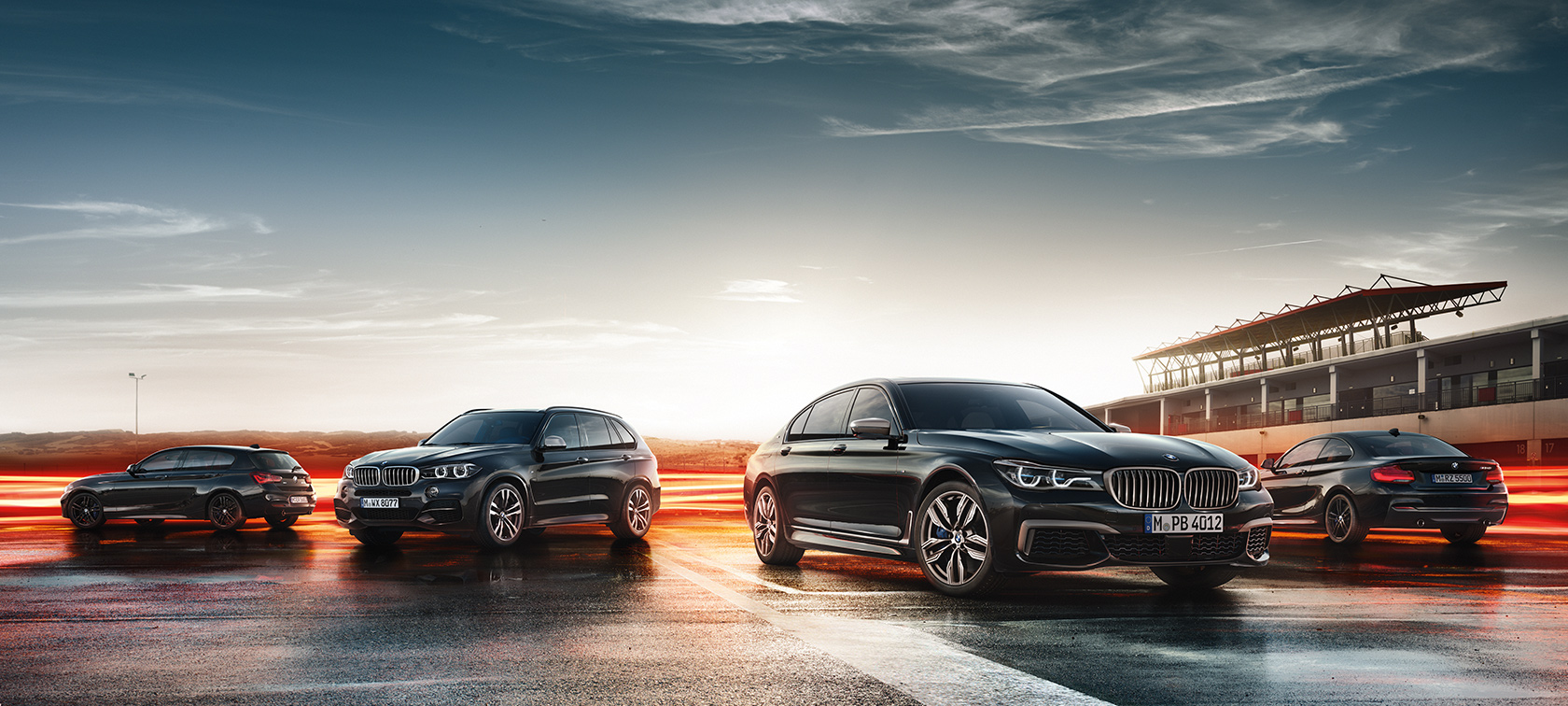 Three M Performance Automobiles Three BMW M Performance automobiles standing on wet asphalt