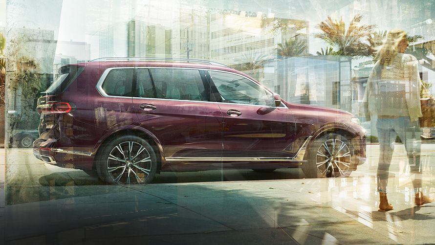 BMW X7 Individual xDrive40i G07 2018 ametrin metallic side view parking in a city 