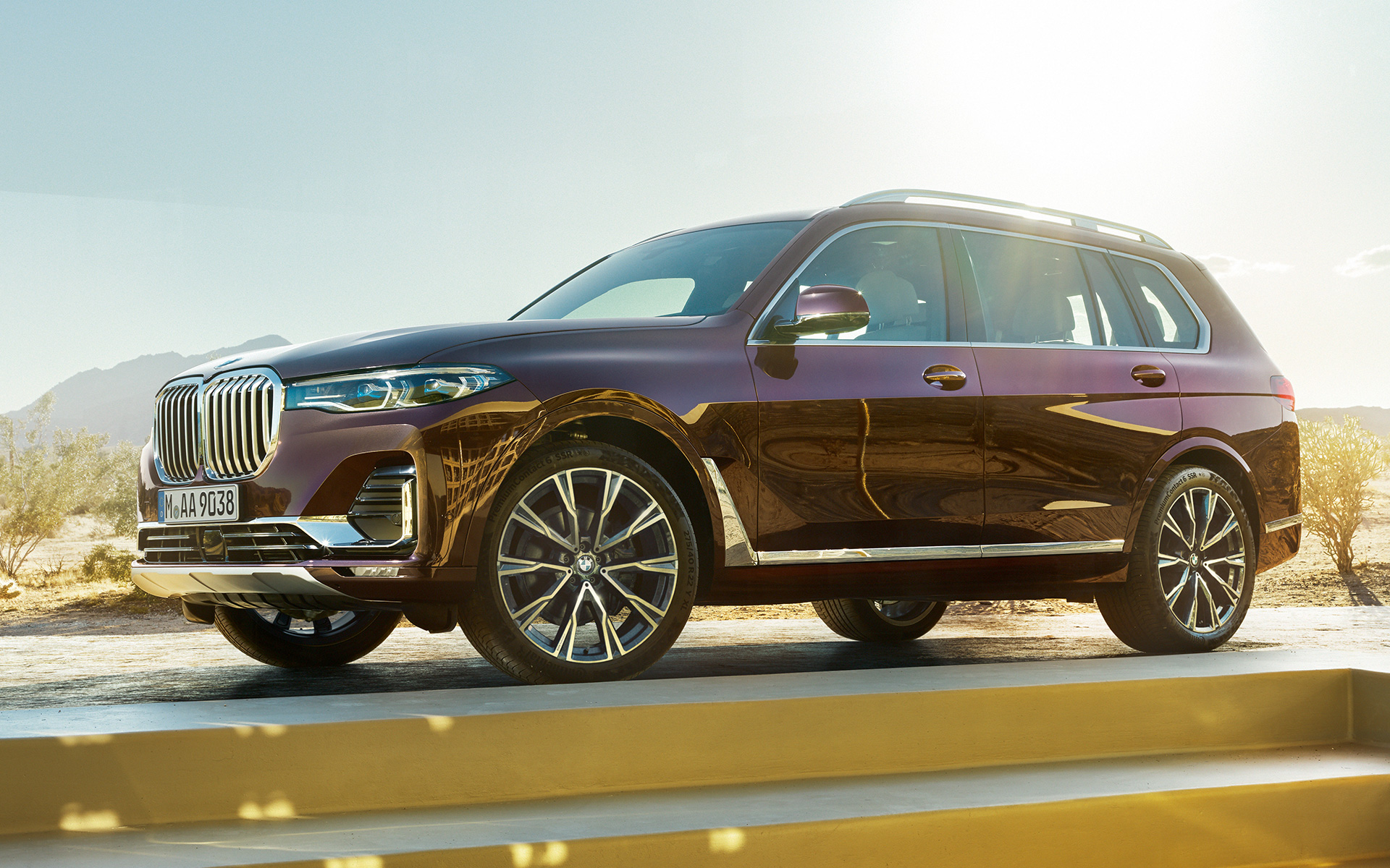 BMW X7 Individual xDrive40i G07 2018 ametrin metallic side view standing with a desert in the background