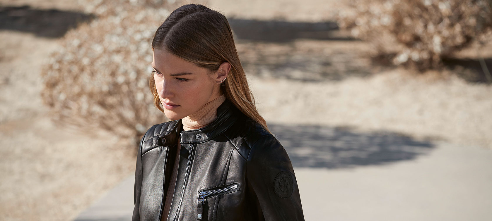 BMW Leather Jacket, Ladies. A female model is wearing the BMW Leather Jacket for ladies.