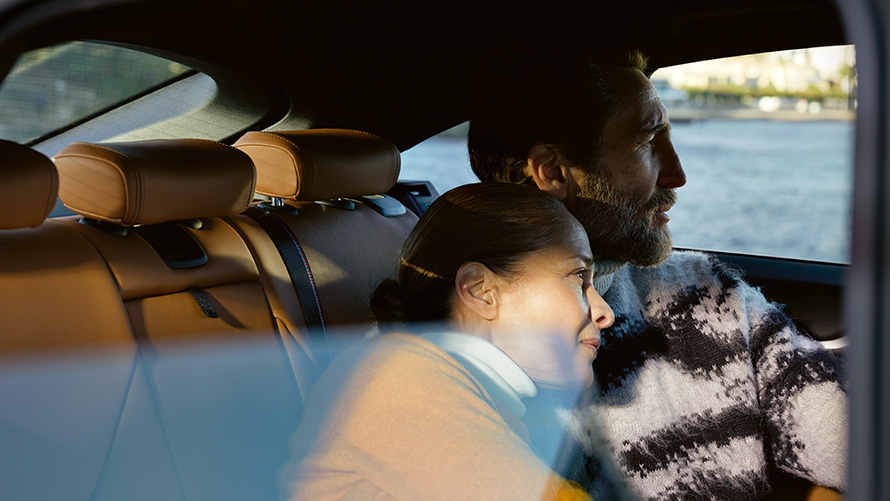 BMW Extended Warranty BMW Extended Warranty man and woman lean against each other on backseats