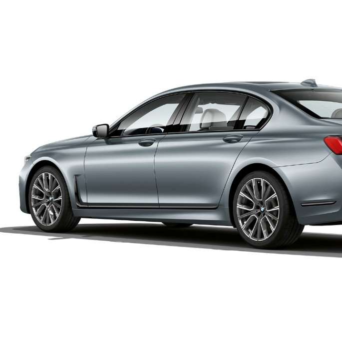 BMW 7 Series Sedan M Sport package, three-quarter rear view Grey BMW 7 Series Sedan M Sport package in three-quarter rear view